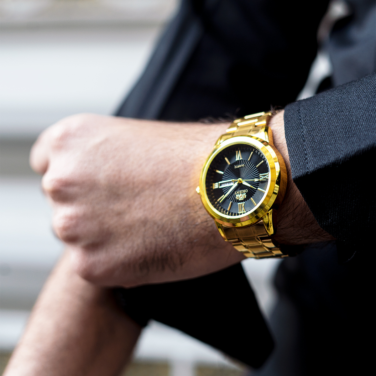 ساعت مچی Orient طلایی صفحه مشکی مدل Z20